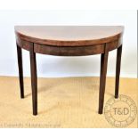 A George III style 'D' shaped card table, on tapered legs, 69cm H x 96cm W x 48cm D,