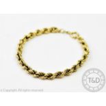 A 9ct yellow gold bracelet, the uniform rope twist bracelet with attached bolt ring clasp,