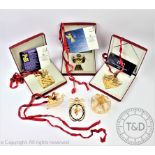 Six Georg Jensen gold plated Christmas tree decorations, comprising; a gift, angel, rocking deer,