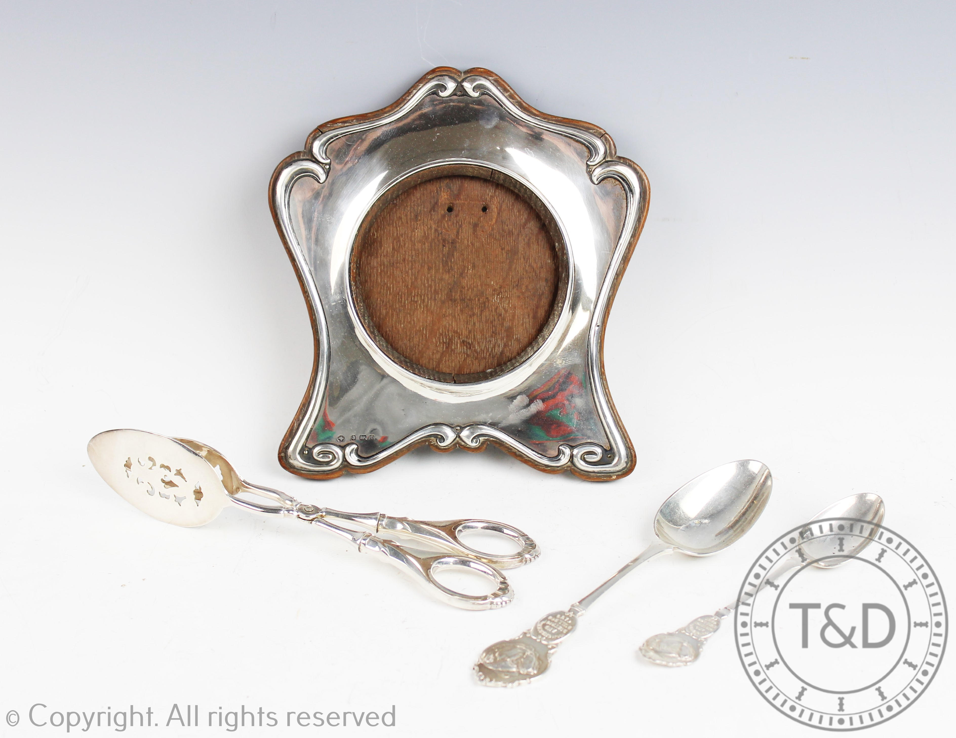 A selection of assorted silver ware to include a pair of silver servers, 20.