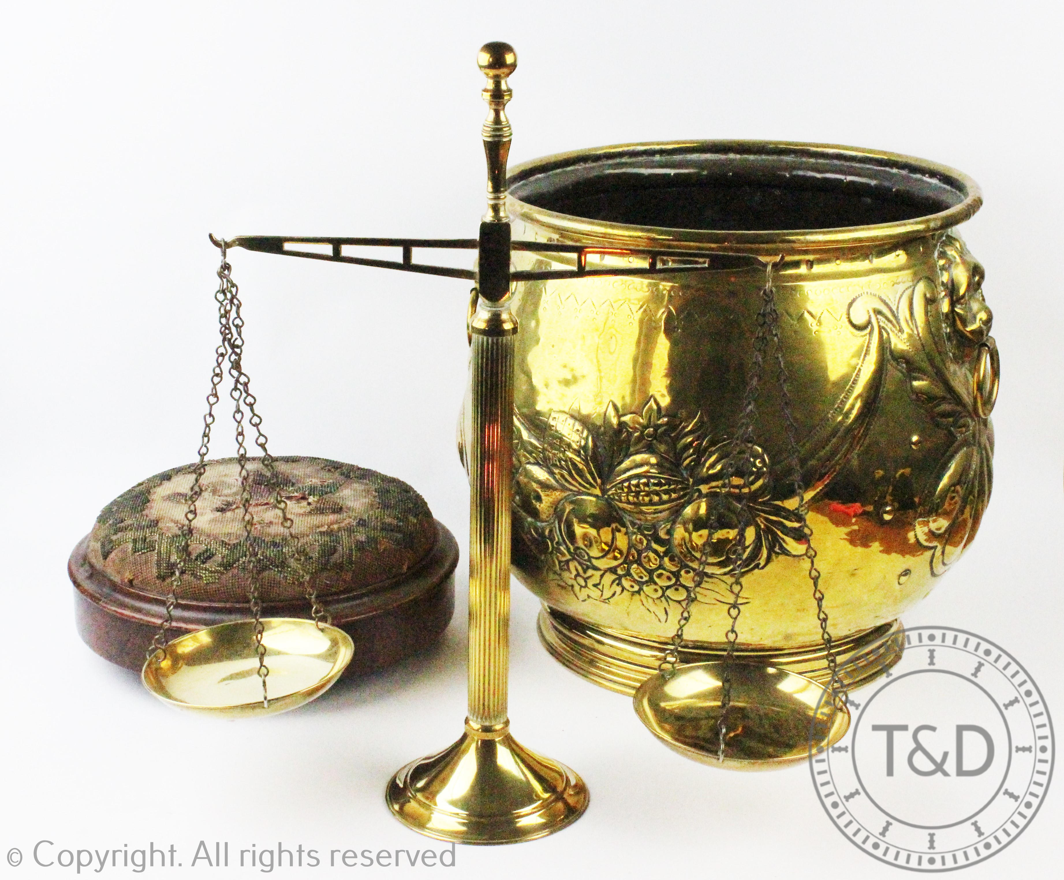 An early 20th century embossed brass jardiniere / coal bucket, 34cm high,