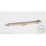 A diamond set stick pin/brooch, the brilliant cut diamond (measuring approx 0.