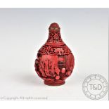 A Chinese cinnabar lacquer snuff bottle, Qianlong seal mark,