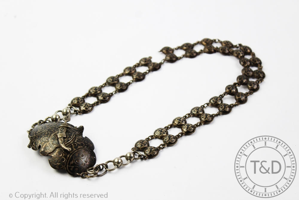 A Russian silver and niello belt, with jambiya fastening clasp,