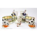 A selection of Staffordshire pottery figures, to include, a pair of spaniels with pup, 15cm high,