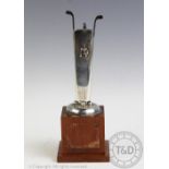 Golfing interest: A Spanish silver golfing trophy on oak block base,