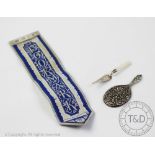 A silver bladed and mother of pearl handled trowel form book mark, William Henry Leather,