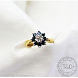 A diamond and sapphire set cluster ring in 18ct gold,