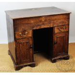 A George III and later oak desk,