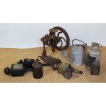 A vintage cast iron work top hand drill, 51cm high, with two coaching lamps, a signal type lamp,