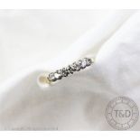 A seven stone diamond eternity ring,