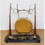 A novelty dinner gong formed from two hunting horns stamped for Henry Keat & Sons London,