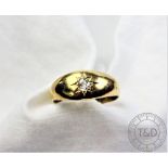 A diamond 'gypsy' set ring, the yellow metal hoop stamped '18ct',