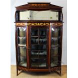 An Arts and Crafts mahogany display cabinet in the manner of Shapland and Petter,