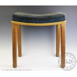 A 1953 Queen Elizabeth II Coronation stool, with curved seat and chamfered limed oak legs,