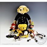 A collection of assorted Vintage toys and puppets to include a Merrythought bear in uniform, 41cm,