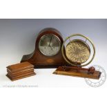 An Edwardian table gong on a mahogany base, 24cm high, an oak money box, 16cm wide,