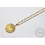 A coin set pendant and chain,