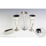 A pair of silver vases, Birmingham 1931, 15cm, (loaded bases), with a silver vase,