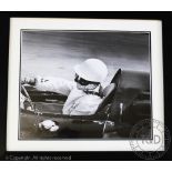 'Cooper Cockpit' a black and white photographic motor racing print, signed by Stirling Moss,