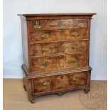 An 18th century walnut chest on stand, with three short and three long drawers,