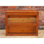 A Globe Wernicke two section light oak bookcase, no base section, 68cm H x 87cm W x 26.