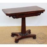 A 19th century rosewood card table with turned column and platform, on disc feet, 75.