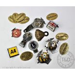 A selection of car badges, including three AA, an Institute of Advanced Motorists badege,