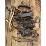A mixed selection of vintage horse tack,