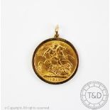 A George V gold sovereign dated 1911, within 9ct gold pendant surround, gross weight 9.
