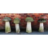Four reconstituted stone garden staddle stones and associated tops,