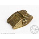 A World War I era bronze advertising paper weight in the form of a WWI tank,