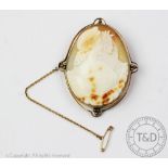A 9ct gold mounted cameo brooch depicting day and night, 6.