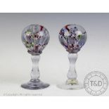 A pair of late 19th/early 20th century glass paperweights,