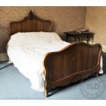 A French walnut small double bed, in Louis XV style,