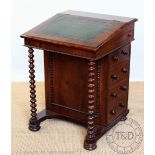 A Victorian mahogany davenport, with leather inset slope enclosing an interior with four drawers,