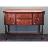 An early 19th century inlaid mahogany sideboard,