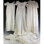 A assortment of Victorian and later children's clothes, to include, christening gowns,