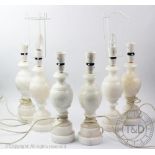 A matched set of six white marble table lamps, with turned detailing, 29.