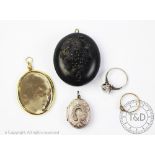 A double sided oval photo locket pendant, stamped '9ct',