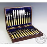 An Edwardian cased set of twelve silver and ivory handled fish knives and forks, John Sanderson,