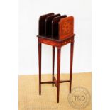 An Edwardian inlaid mahogany three section canterbury, with drawer and tapered square legs,