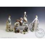 A collection of six Lladro groups, comprising, seated girl with turkey, boy shooting with hound,