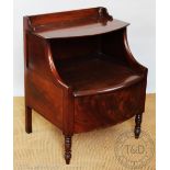 An early 19th century mahogany bow front commode,