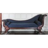 An early 19th century mahogany Empire style day bed / chaise with scroll frame on reeded scroll