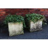 A pair of reconstituted stone garden planters, of fluted square form,