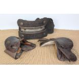 A vintage leather working pony saddle, with hook, metal and wood under-frame,