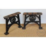 A pair of cast iron bench ends, dated 1993,