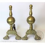 A pair of 19th century brass and cast iron chenet, in the Dutch style,