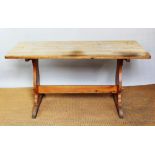 A pine refectory type table, on standard end supports,